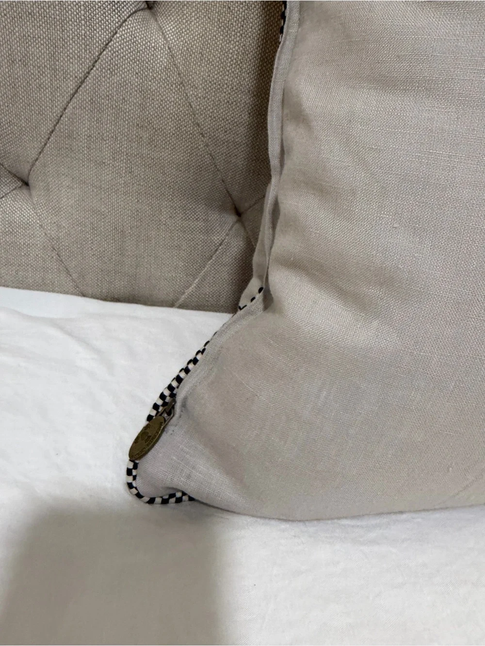 Mackenzie-Childs Brass Oval Logo Tag on Textured Fabric Pillow